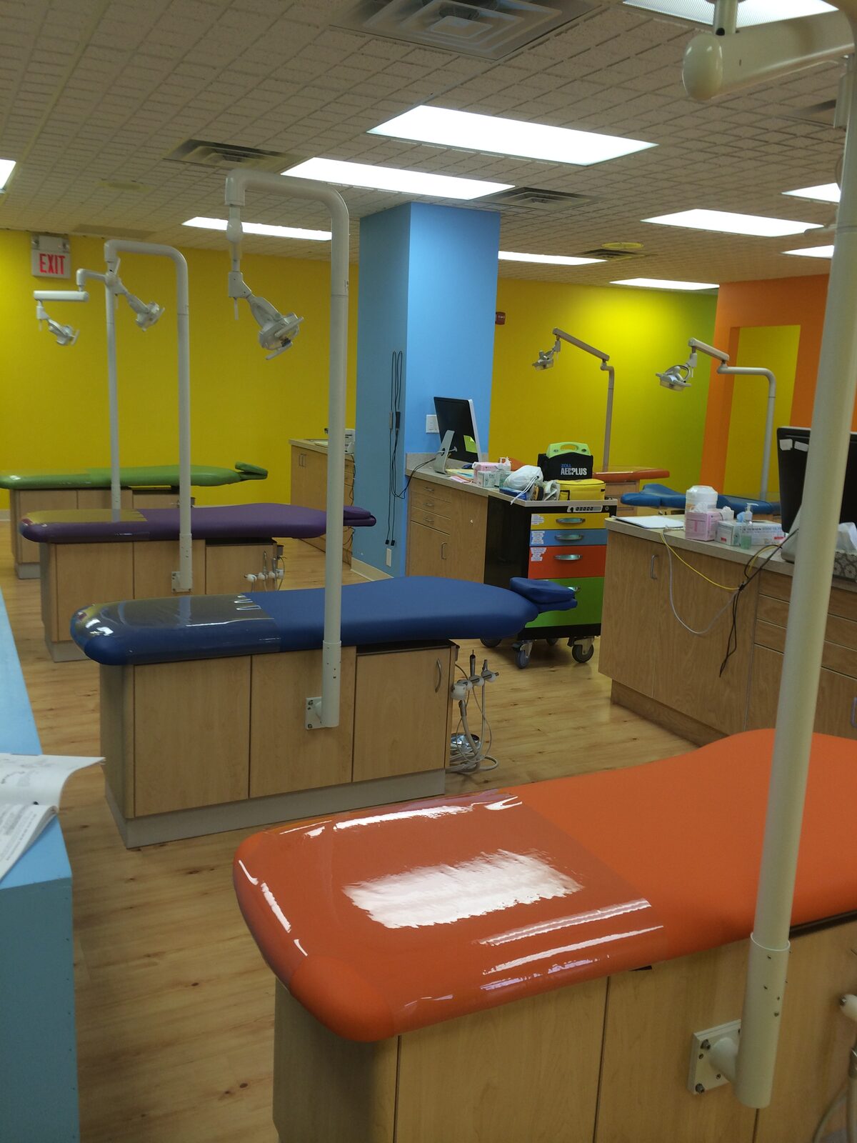 Colorful pediatric dental operatory equipped with Royal Dental Group chairs